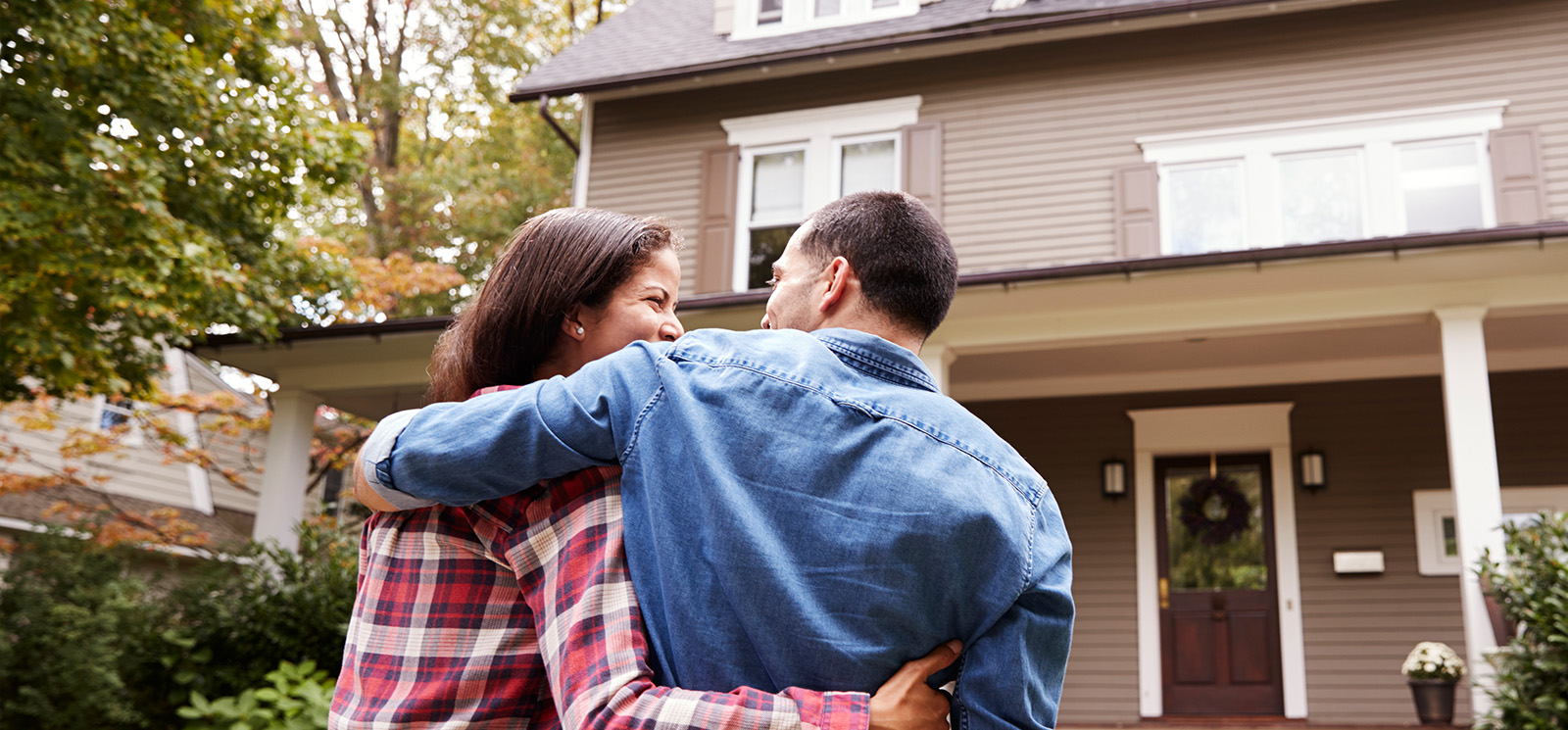 Couple outside of a house